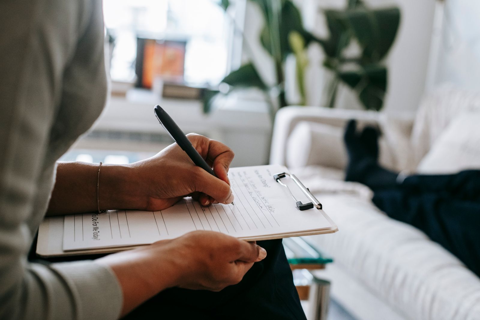 Daycare provider filling out paperwork at her desk