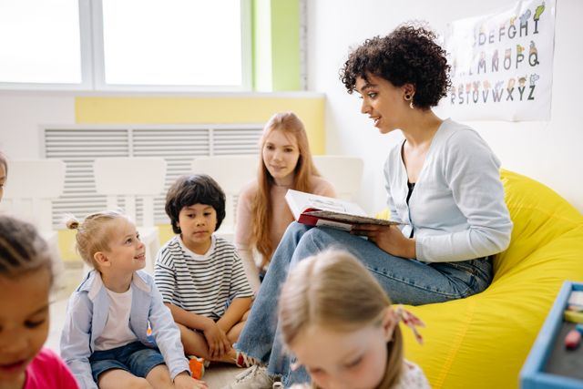 Teacher reading a book to preschool children in a classroom